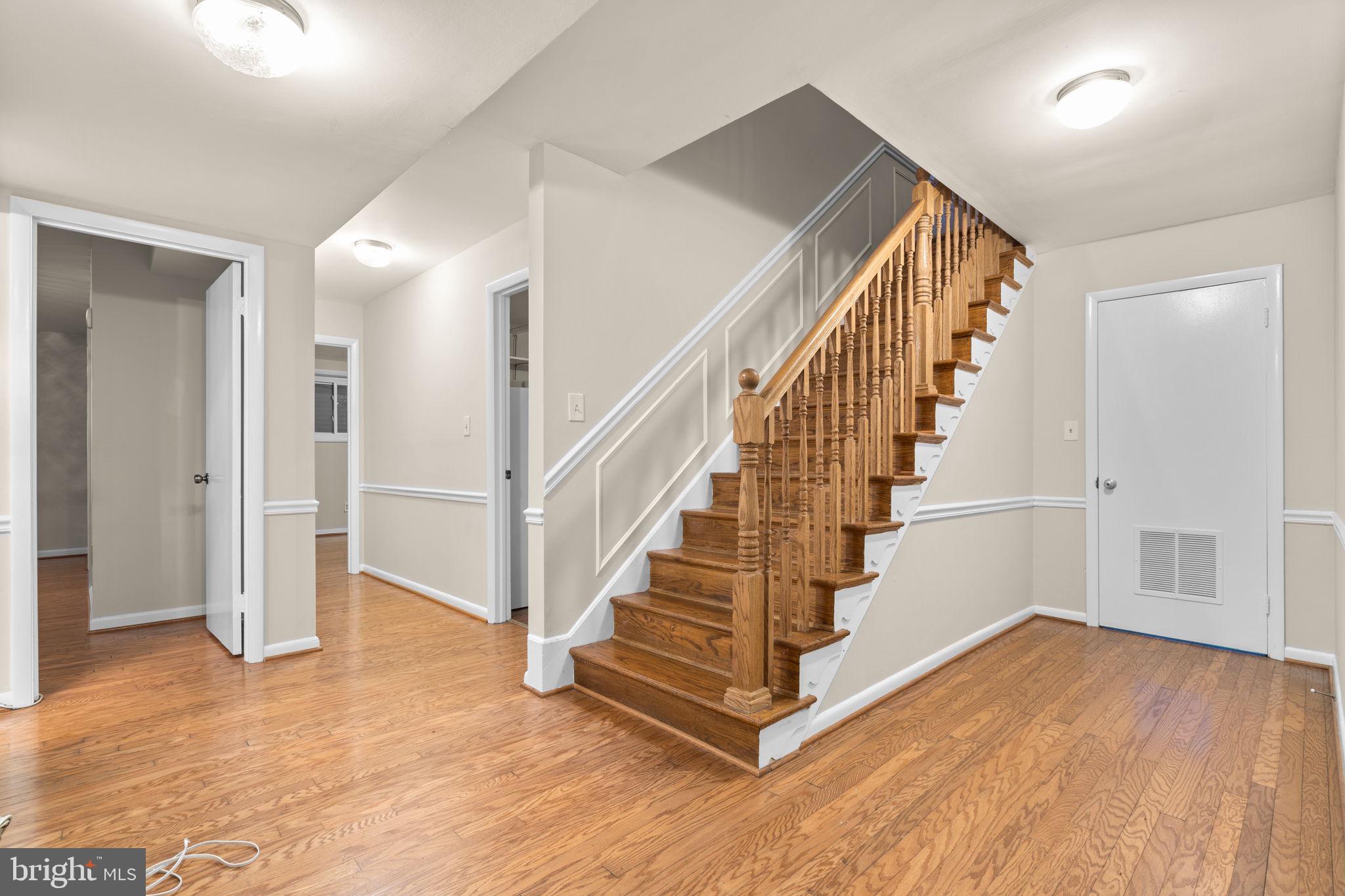7711 Arrowood Court Bethesda, MD 20817 - Photo 35 of 59 a view of entryway and hall with wooden floor
