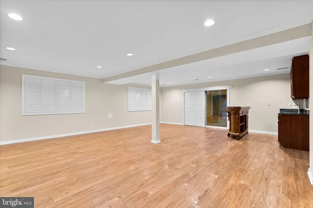 an empty room with wooden floor