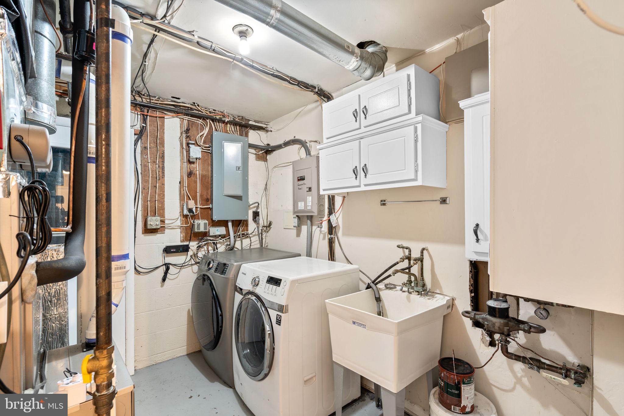 7711 Arrowood Court Bethesda, MD 20817 - Photo 50 of 59 a utility room with dryer and washer