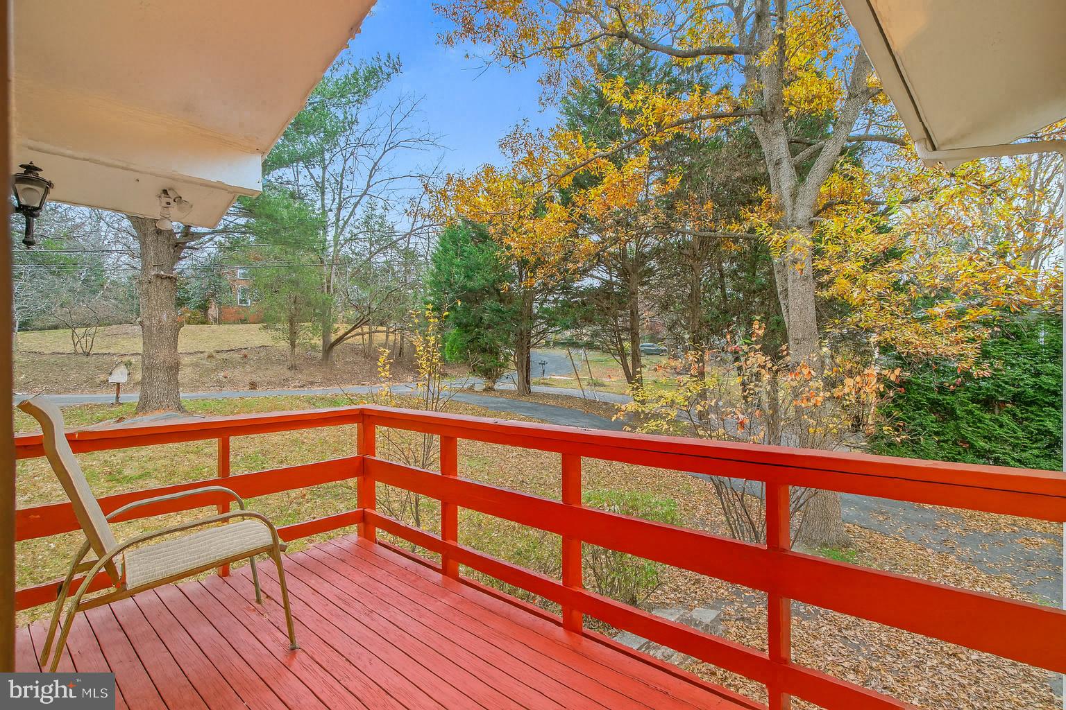 7711 Arrowood Court Bethesda, MD 20817 - Photo 57 of 59 a view of a balcony with wooden floor and outdoor space