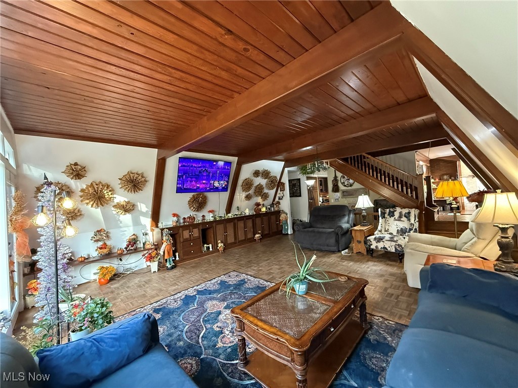 8116 Deer Road Southwest Bowerston, OH 44695 - Photo 3 of 49 Living room featuring stairway and a wood ceiling with exposed beams
