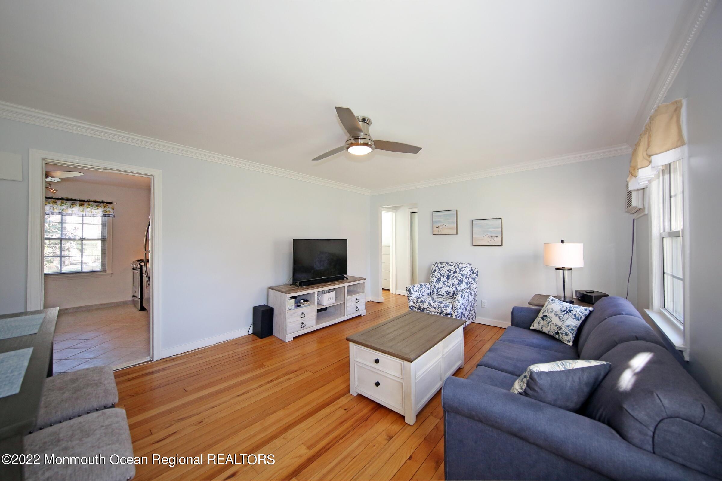 40 Pinckney Road, Unit 40B Red Bank, NJ 07701 - Photo 11 of 23 a living room with furniture and a flat screen tv