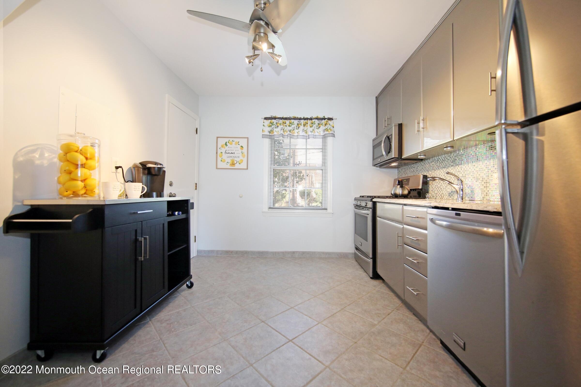 40 Pinckney Road, Unit 40B Red Bank, NJ 07701 - Photo 15 of 23 a kitchen with stainless steel appliances a refrigerator and a stove
