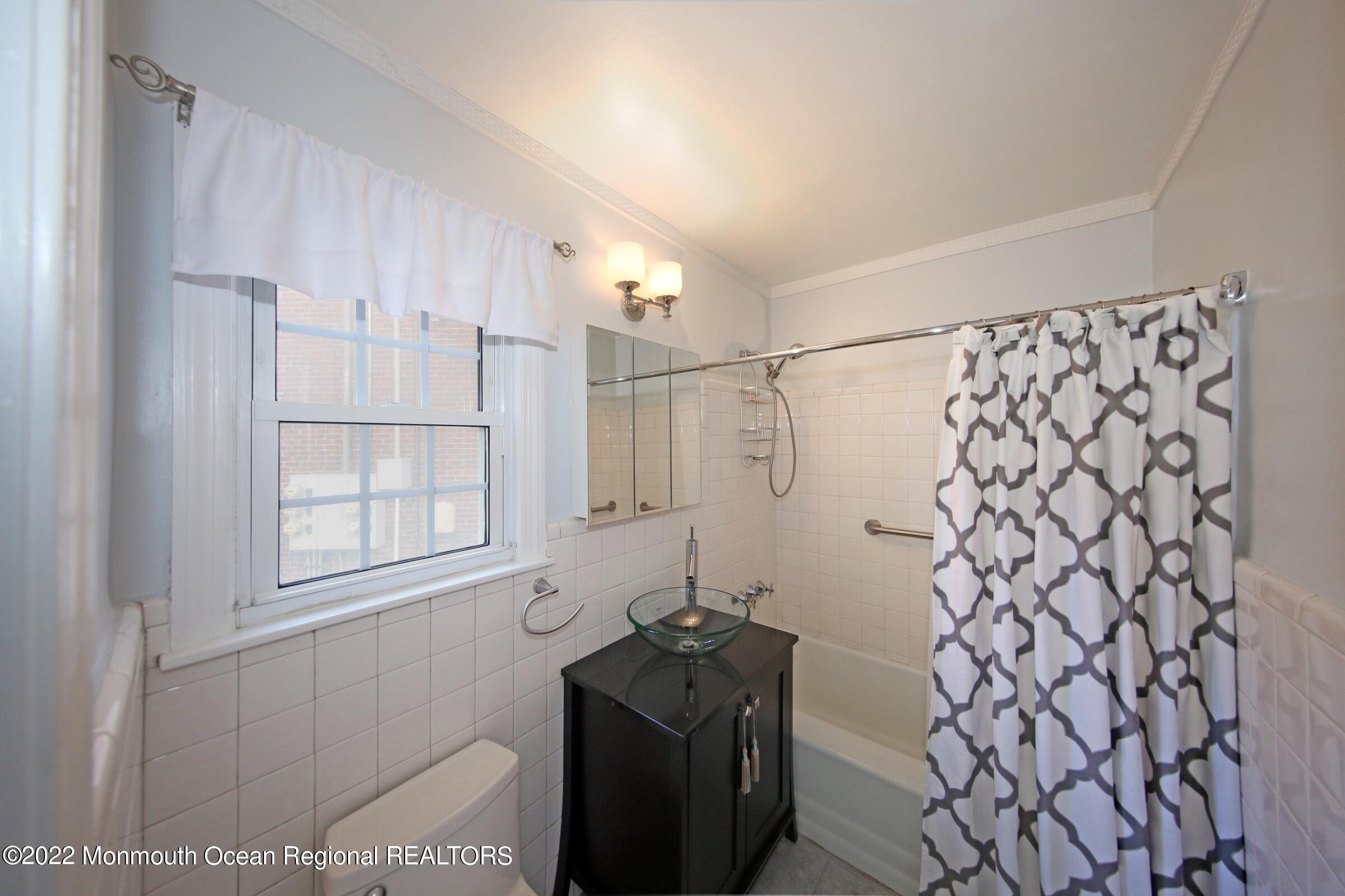 40 Pinckney Road, Unit 40B Red Bank, NJ 07701 - Photo 20 of 23 a room with a cabinet and a window