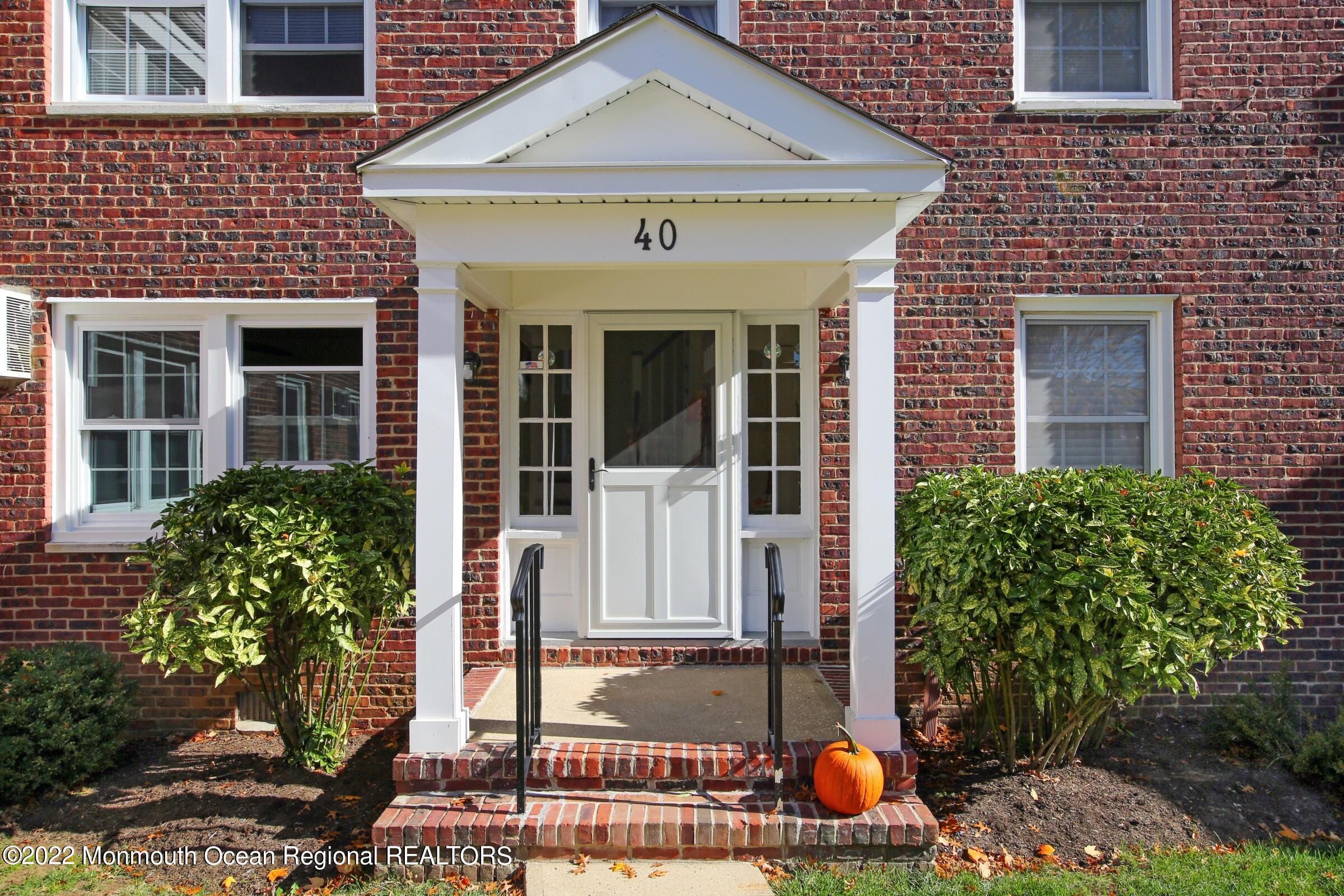 40 Pinckney Road, Unit 40B Red Bank, NJ 07701 - Photo 2 of 23 a front view of a house with garden