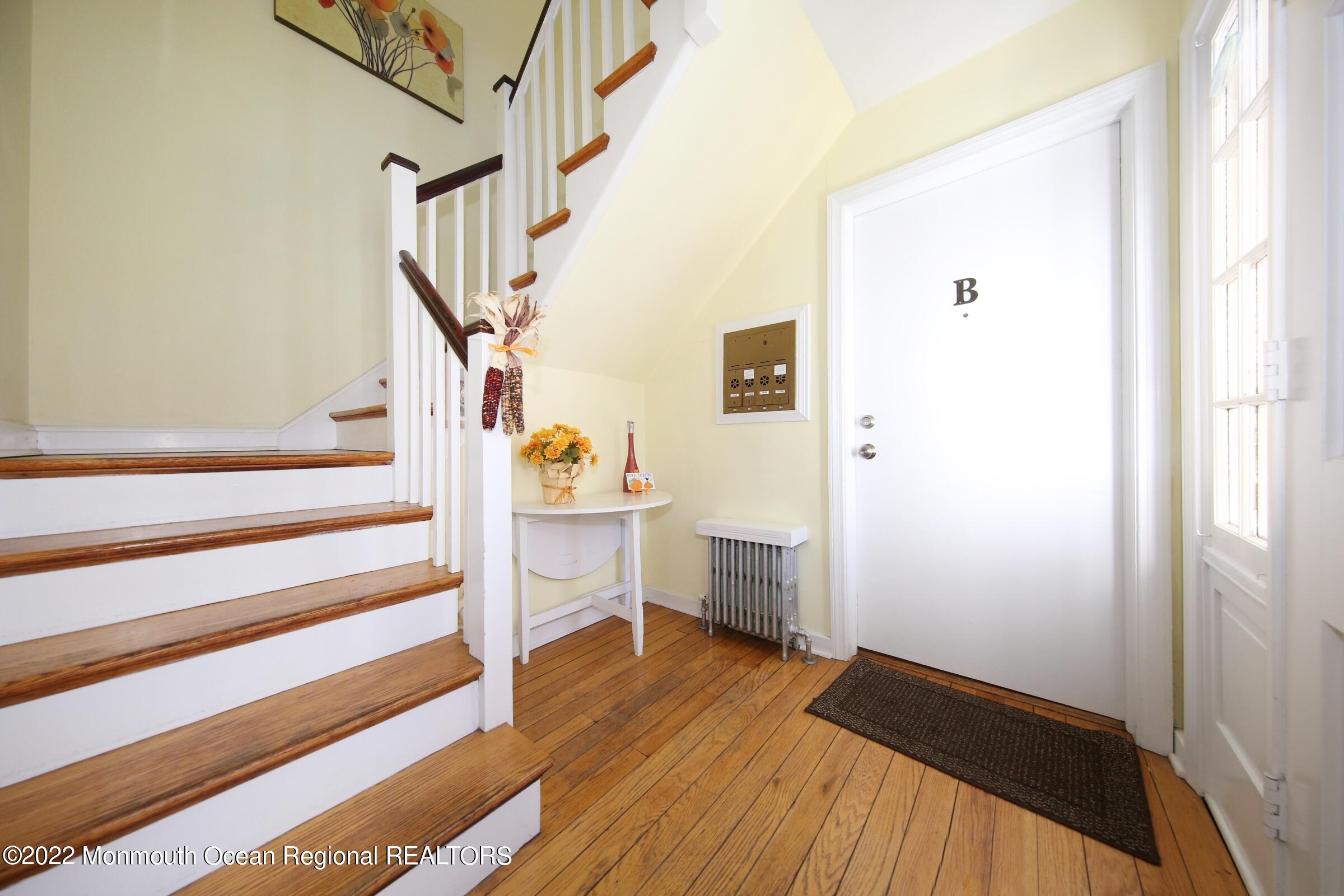 40 Pinckney Road, Unit 40B Red Bank, NJ 07701 - Photo 4 of 23 a view of entryway with wooden floor and stairs