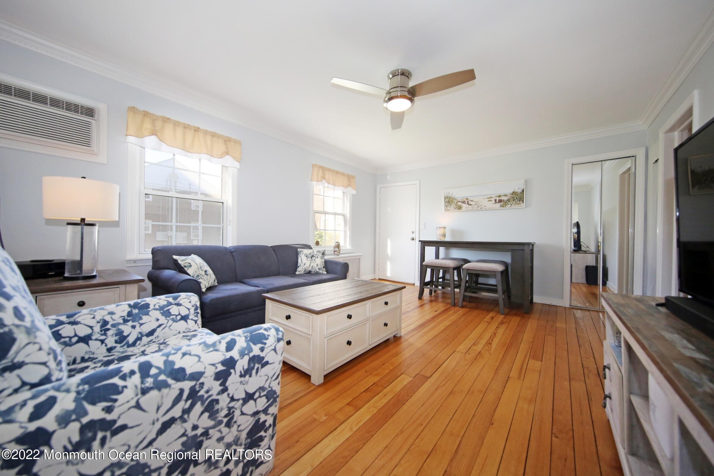 40 Pinckney Road, Unit 40B Red Bank, NJ 07701 - Photo 9 of 23 a living room with furniture and a fireplace