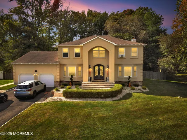 a view of a house with swimming pool and sitting area