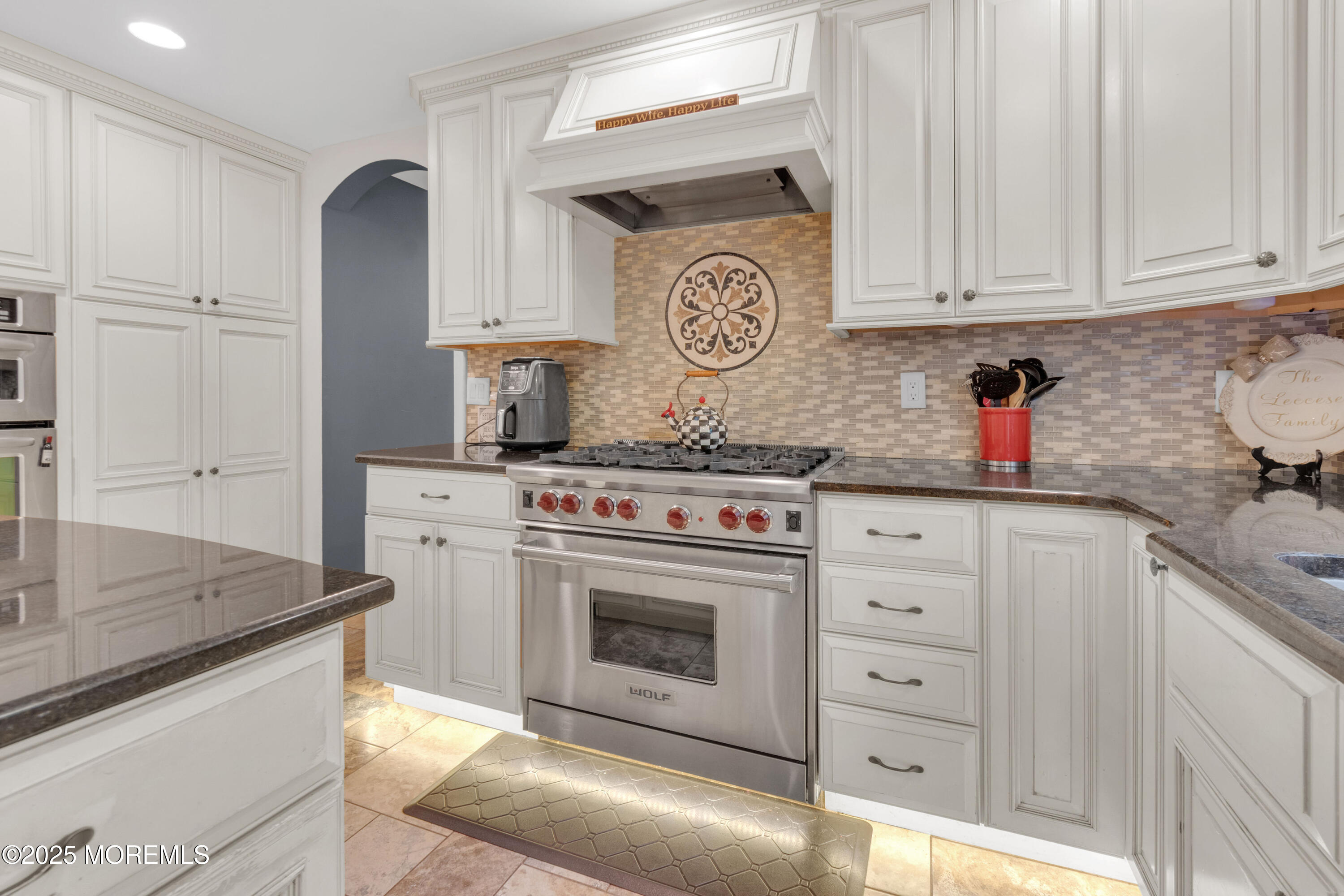 41 Longstreet Road Manalapan, NJ 07726 - Photo 11 of 51 a kitchen with stainless steel appliances granite countertop a sink stove and cabinets