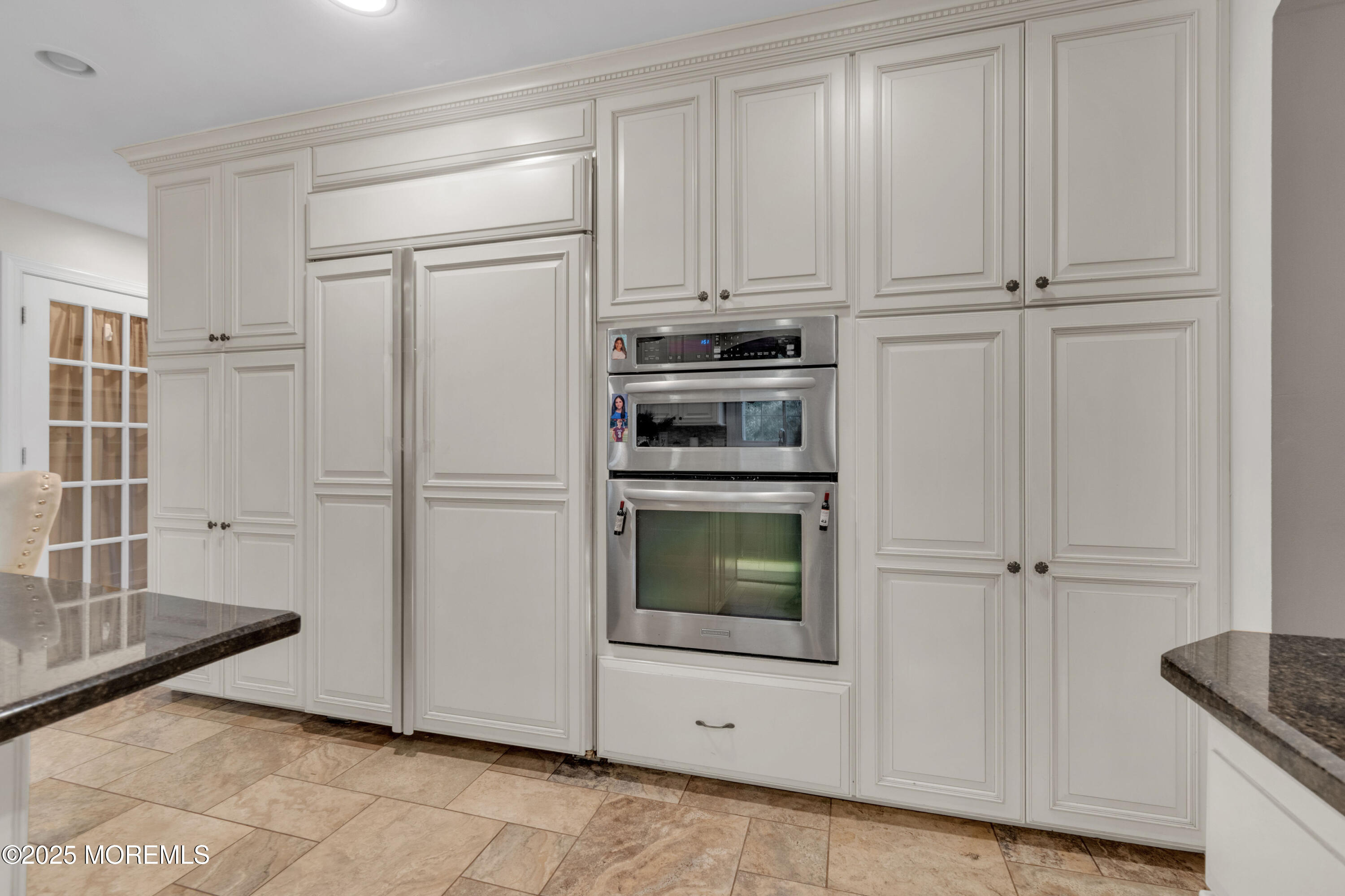 41 Longstreet Road Manalapan, NJ 07726 - Photo 13 of 51 a kitchen with white cabinets and refrigerator