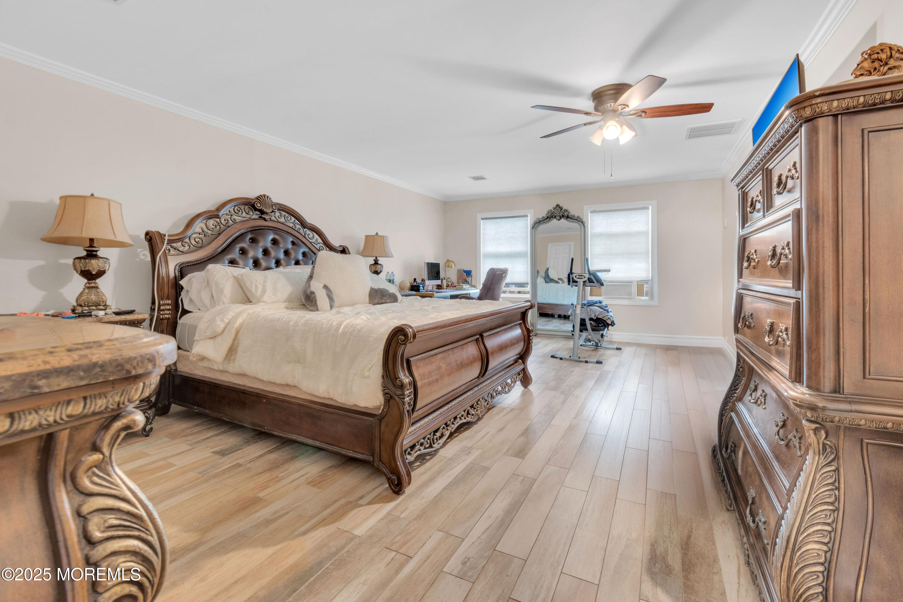 41 Longstreet Road Manalapan, NJ 07726 - Photo 16 of 51 a bedroom with a bed and wooden floor