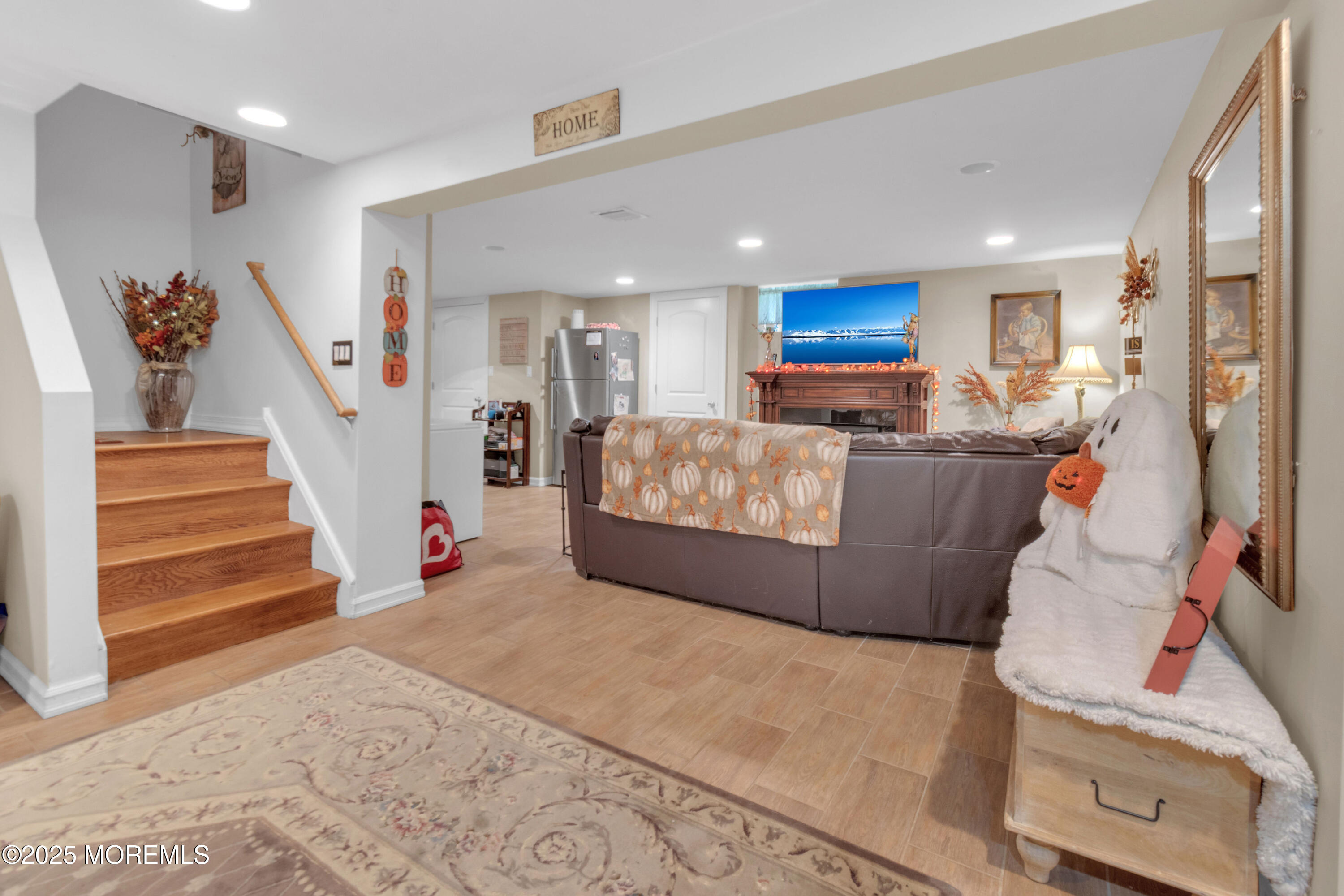 41 Longstreet Road Manalapan, NJ 07726 - Photo 23 of 51 a living room with furniture and a wooden floor