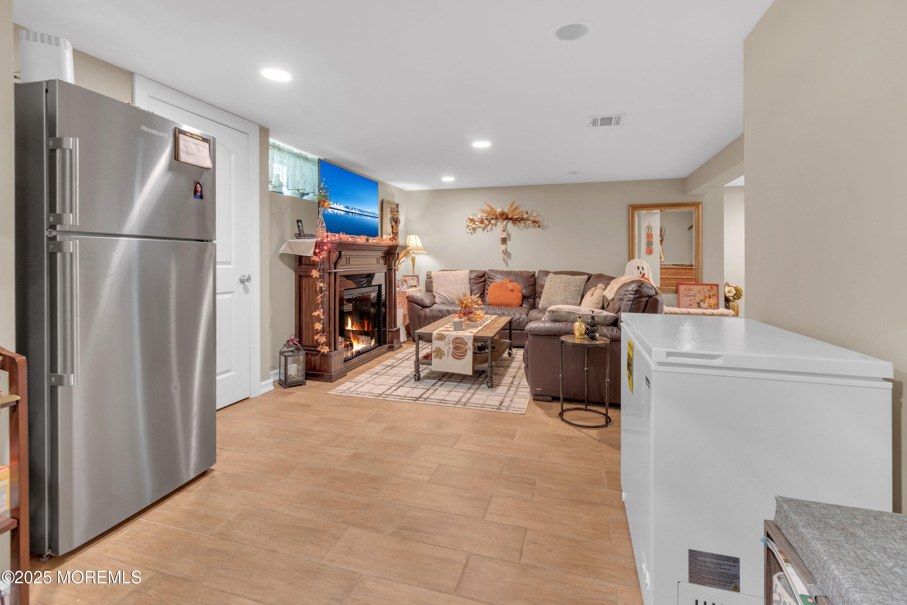 41 Longstreet Road Manalapan, NJ 07726 - Photo 25 of 51 a view of a kitchen with fridge and workspace