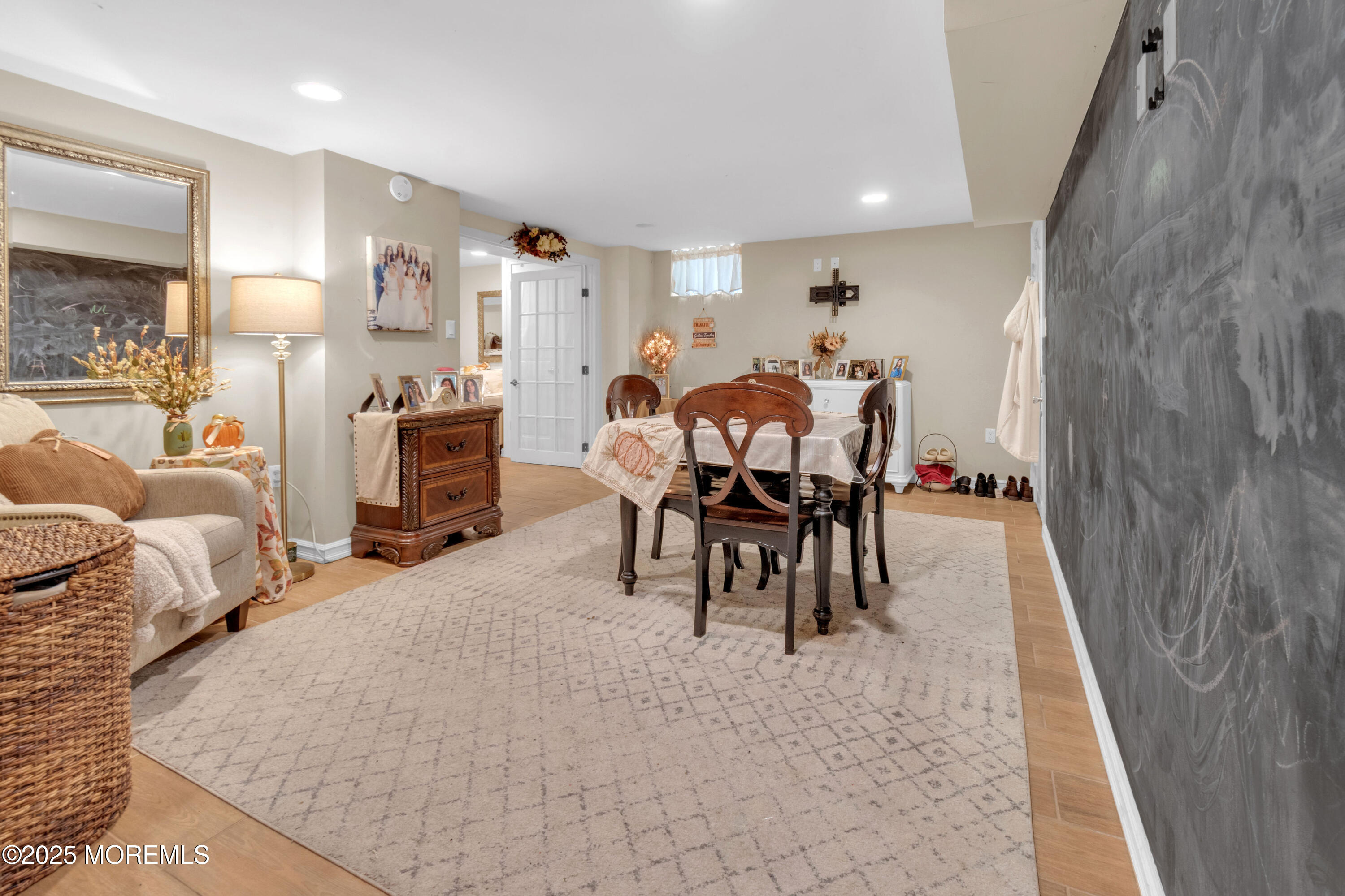 41 Longstreet Road Manalapan, NJ 07726 - Photo 26 of 51 a living room with furniture a dining table and a fireplace