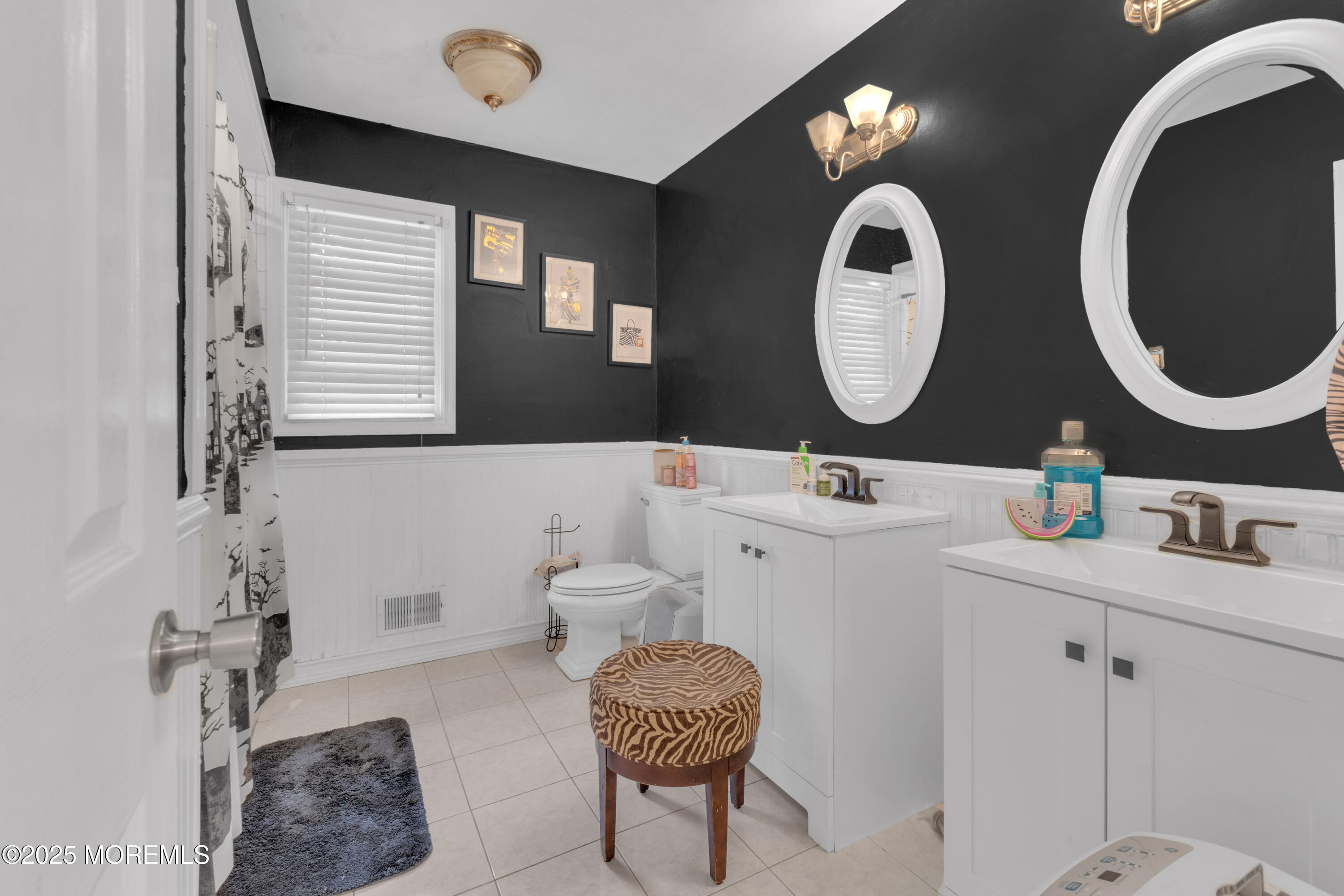 41 Longstreet Road Manalapan, NJ 07726 - Photo 29 of 51 a bathroom with a double vanity sink and a mirror