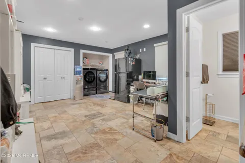a view of a livingroom with furniture and a flat screen tv