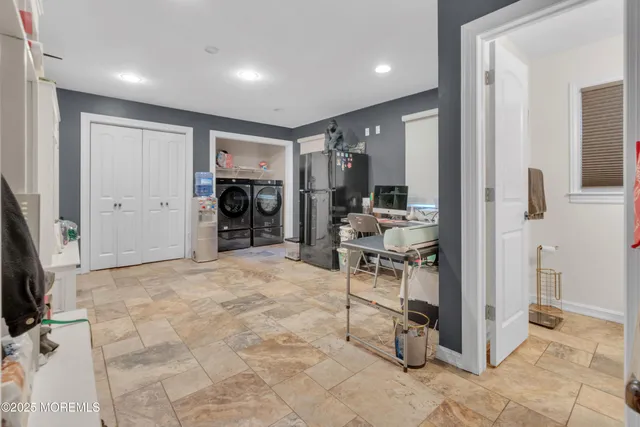 a view of a livingroom with furniture and a flat screen tv