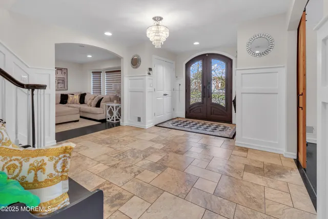 a view of a livingroom with furniture and staircase