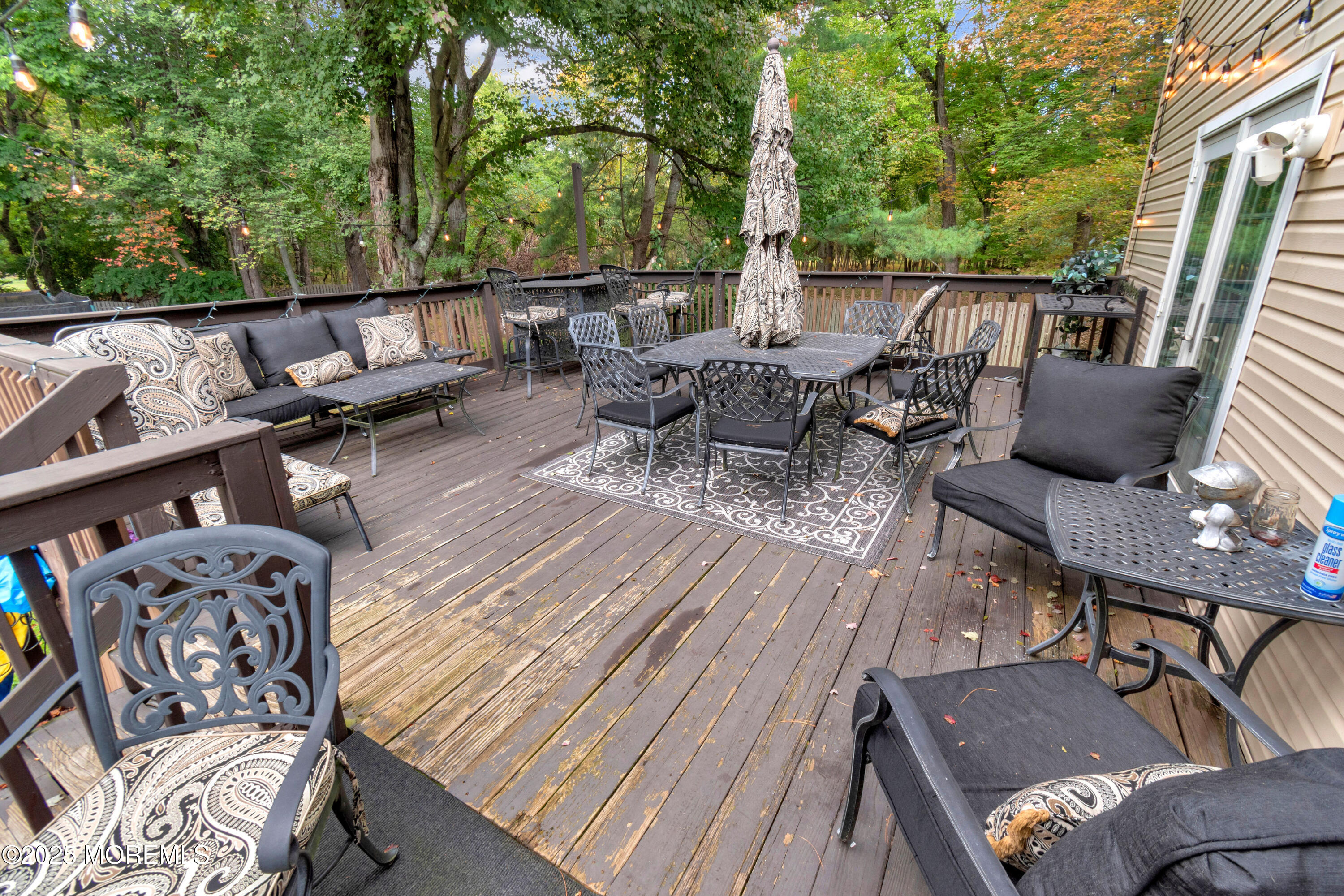 41 Longstreet Road Manalapan, NJ 07726 - Photo 37 of 51 a view of a patio with table and chairs and couches