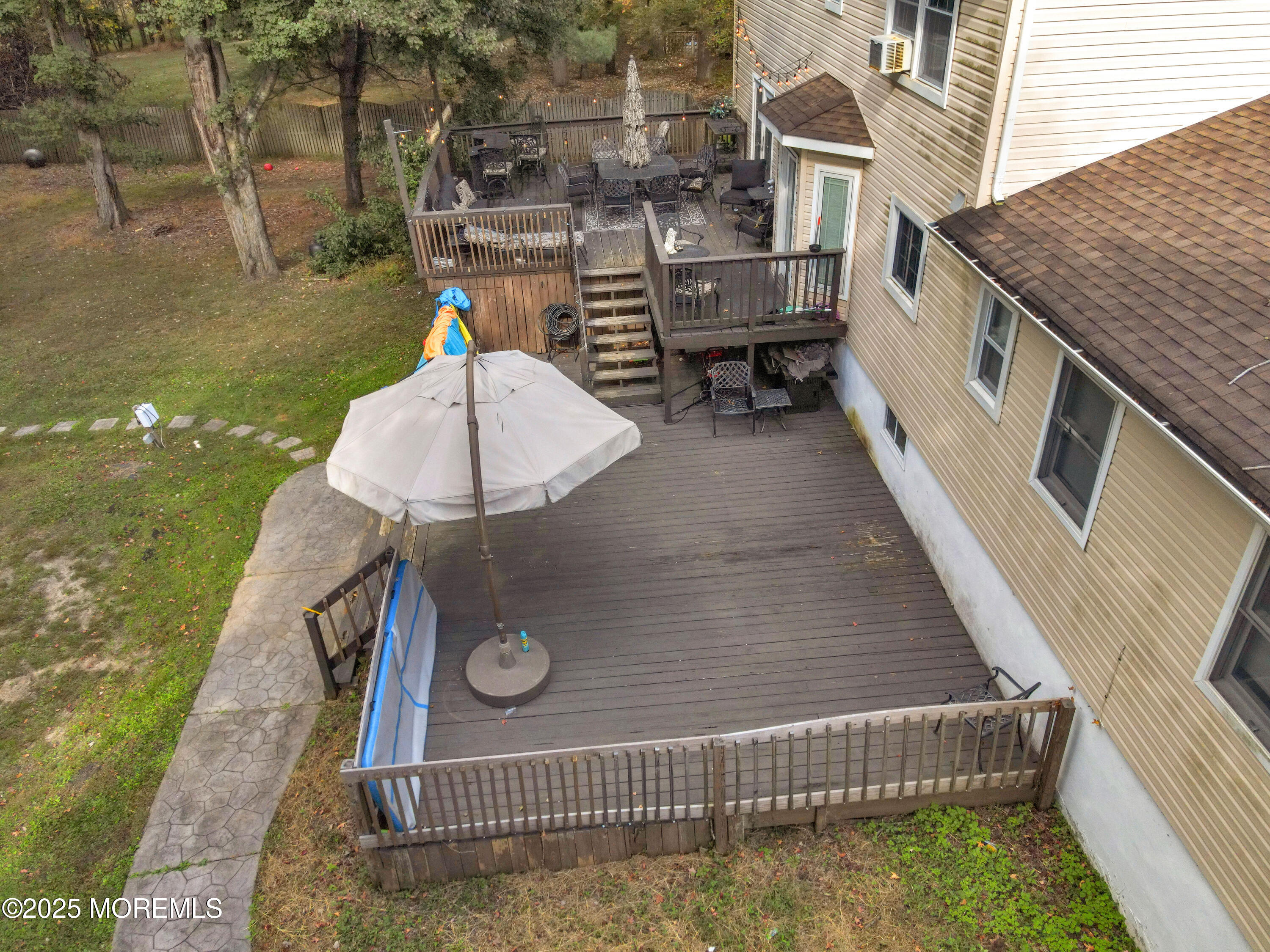 41 Longstreet Road Manalapan, NJ 07726 - Photo 40 of 51 a terrace of a building with table and chairs