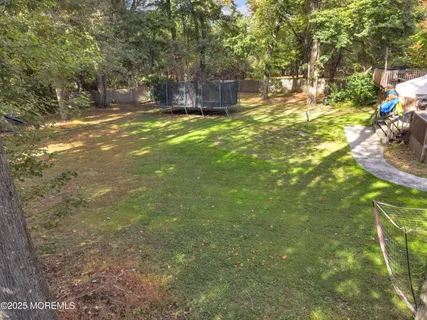 a view of a backyard with sitting area