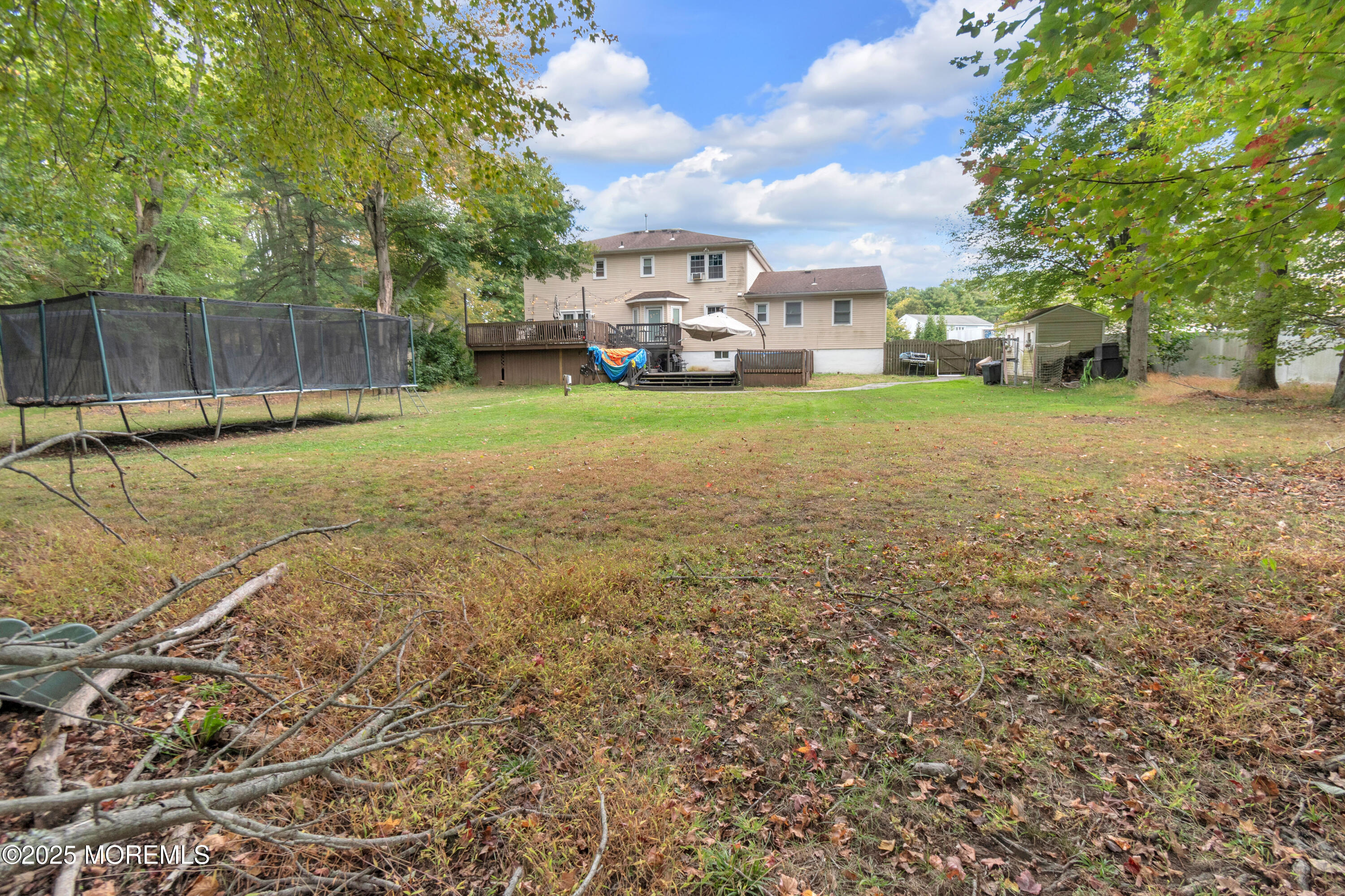 41 Longstreet Road Manalapan, NJ 07726 - Photo 46 of 51 a view of a yard with a house