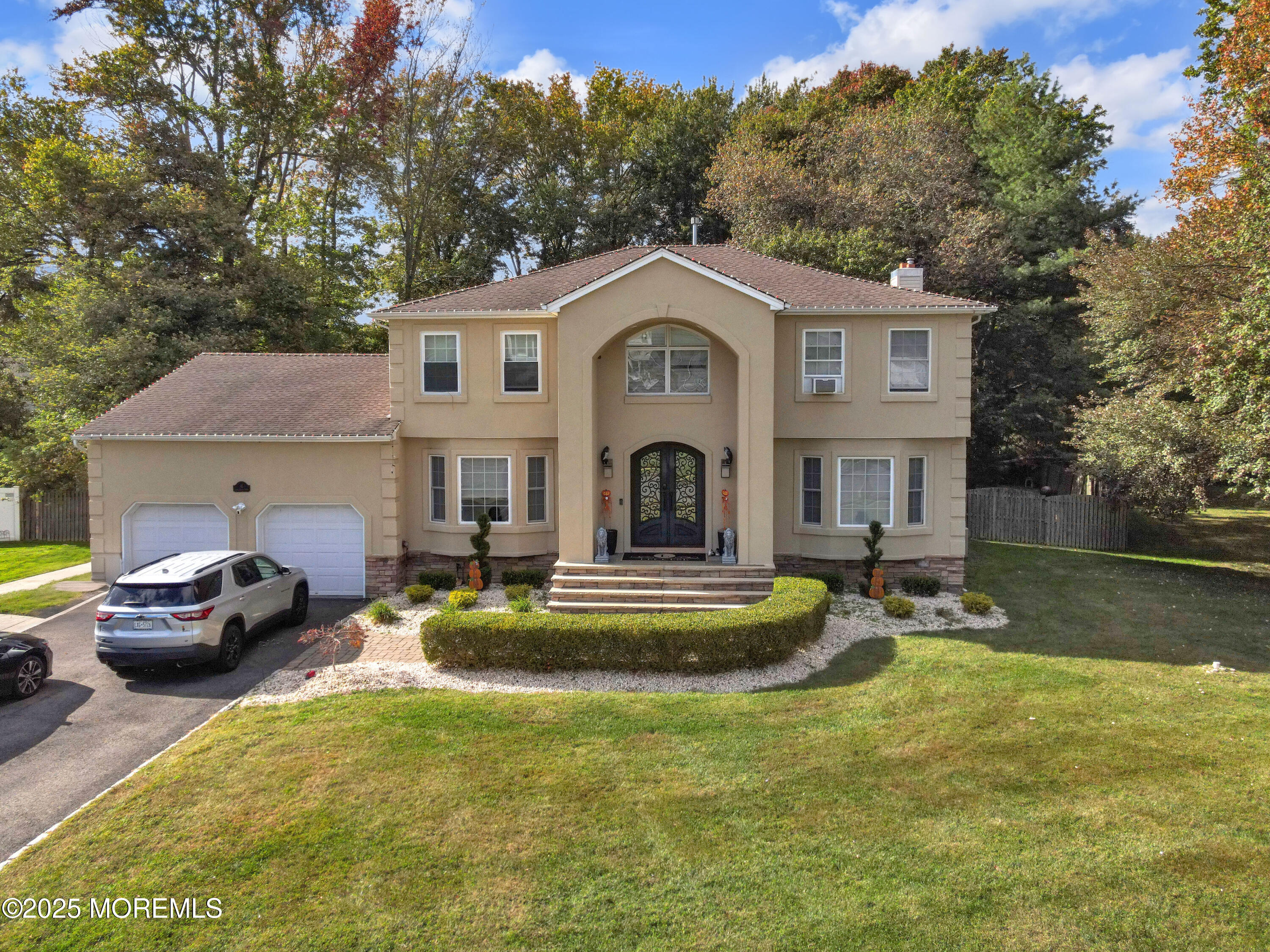 41 Longstreet Road Manalapan, NJ 07726 - Photo 47 of 51 a view of a house with swimming pool and a chairs in patio
