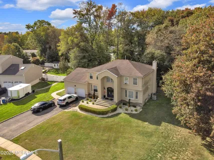 an aerial view of a house with outdoor space