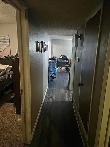 a bedroom with a bed and a mirror