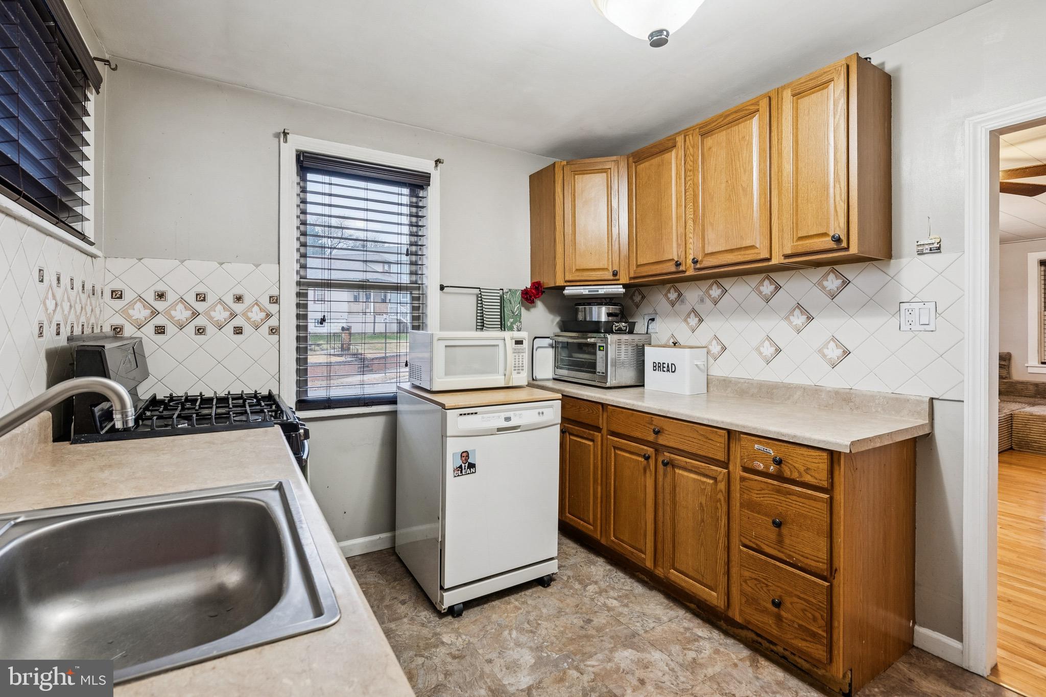 202 South Cedar Avenue Maple Shade, NJ 08052 - Photo 12 of 25 a kitchen that has a sink and a stove