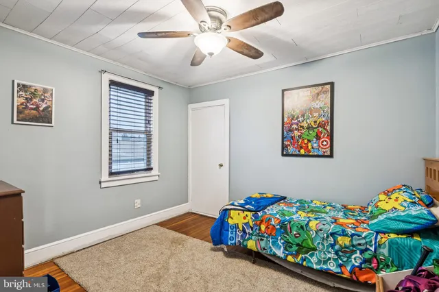 a bedroom that has a bed and a chandelier