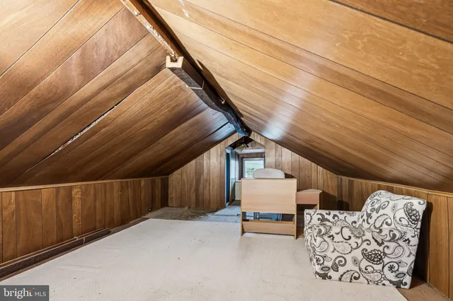 a balcony with furniture and wooden floor