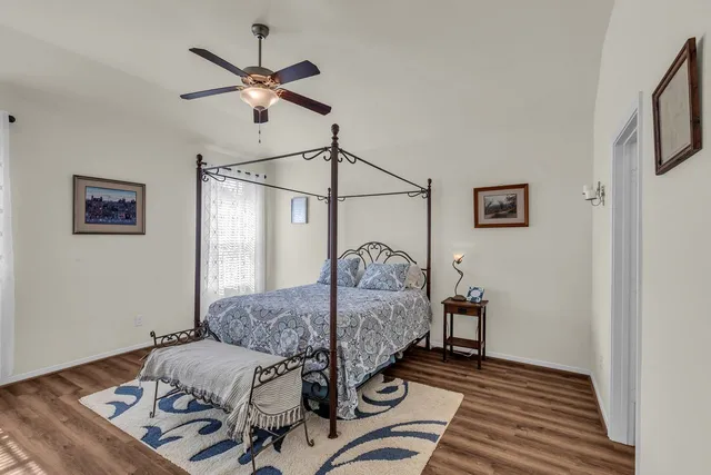 a view of a porch with a dining table and chairs with wooden floor