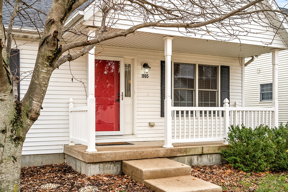 1005 Perry Lane Normal, IL 61761 - Photo 2 of 21 a view of a house with a small wooden and a large tree