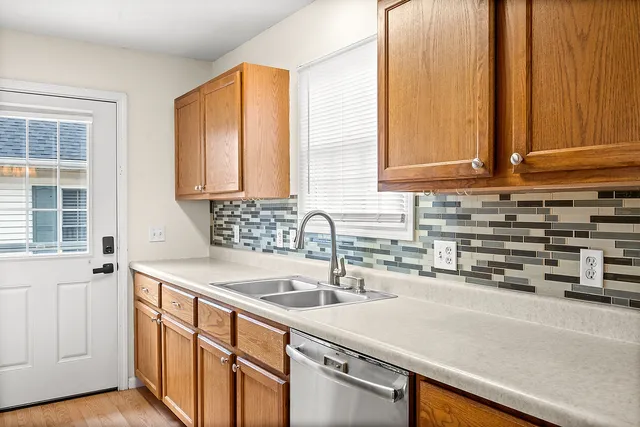 a kitchen with a sink and a window
