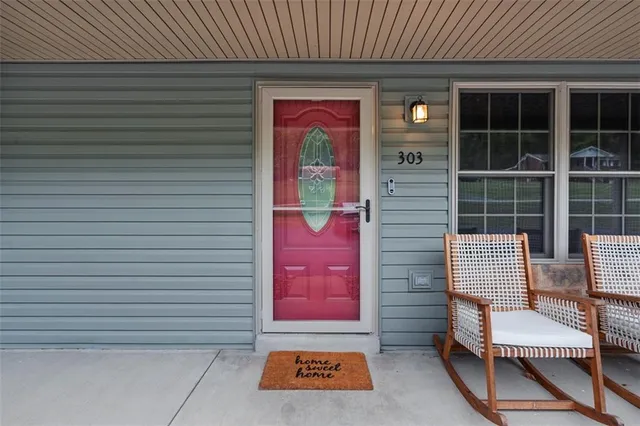 a view of front door with outdoor seating