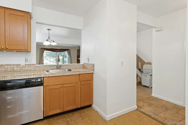 a kitchen with a sink and a stove top oven
