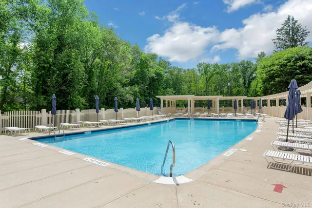 a view of a house with swimming pool