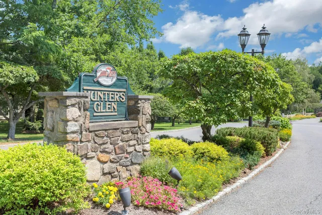 a view of a street with flower plants