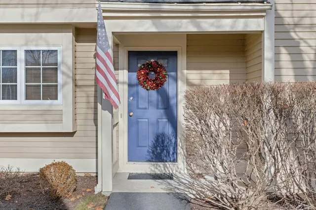 a front view of a house with a garage