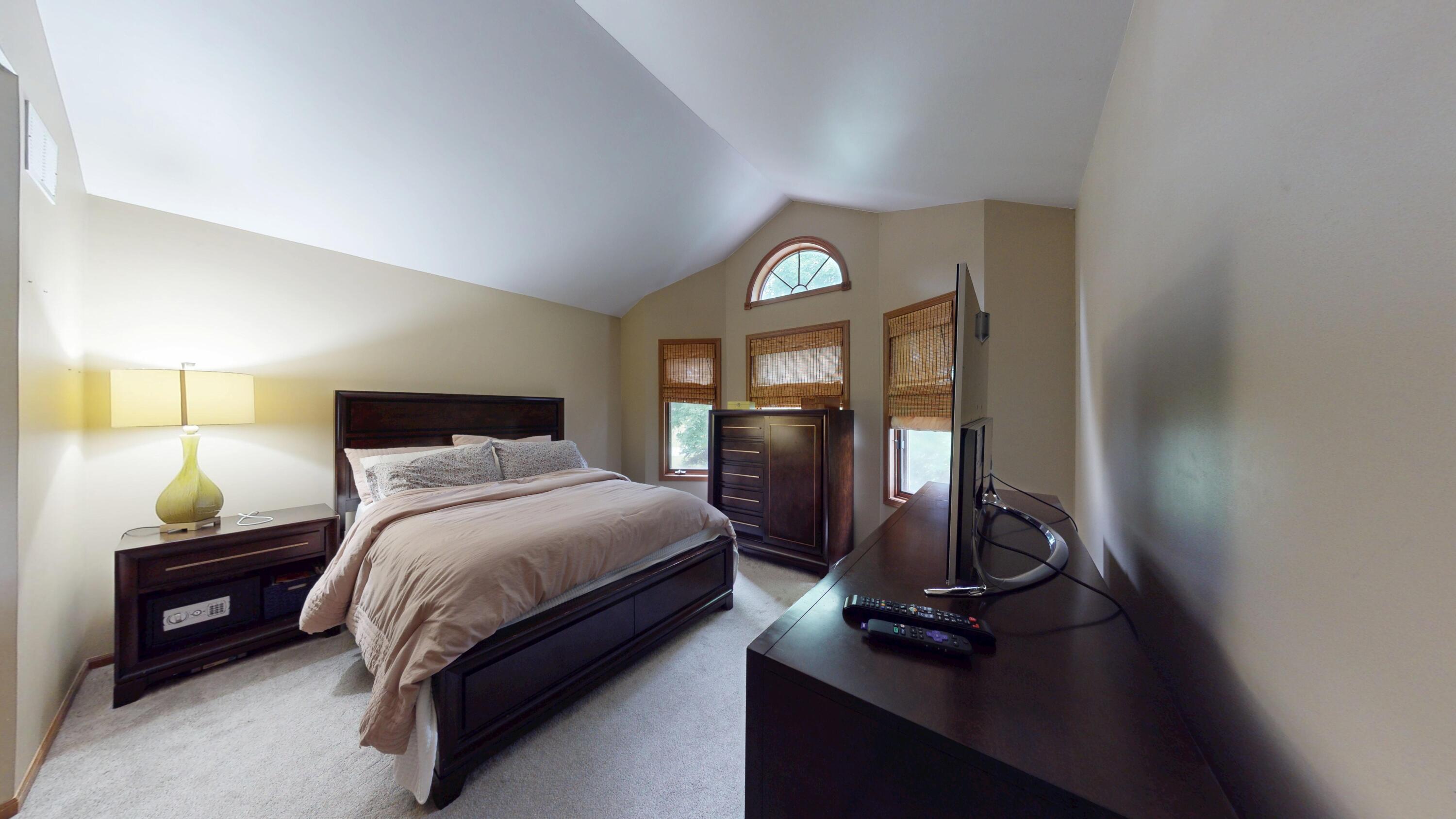9344 Van Buren Street Crown Point, IN 46307 - Photo 25 of 37 a bedroom with a bed and window
