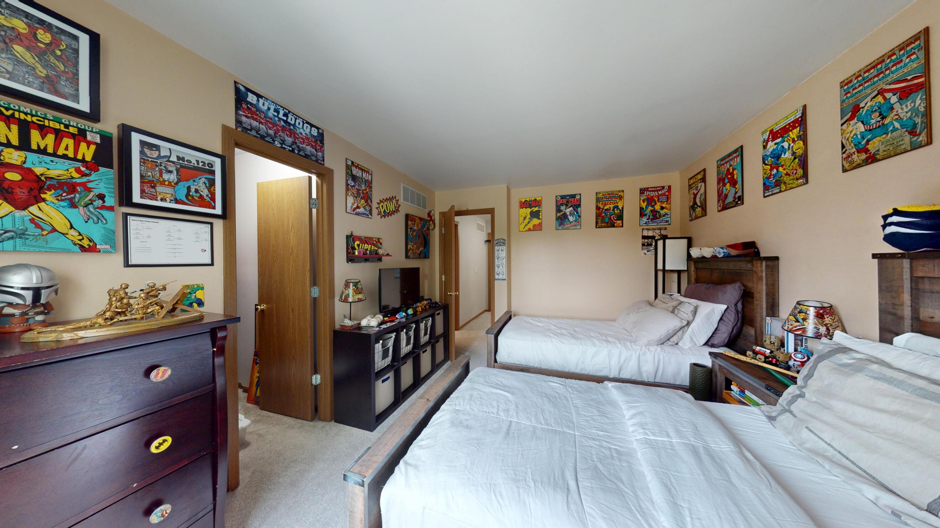 9344 Van Buren Street Crown Point, IN 46307 - Photo 32 of 37 a bedroom with furniture and a bed