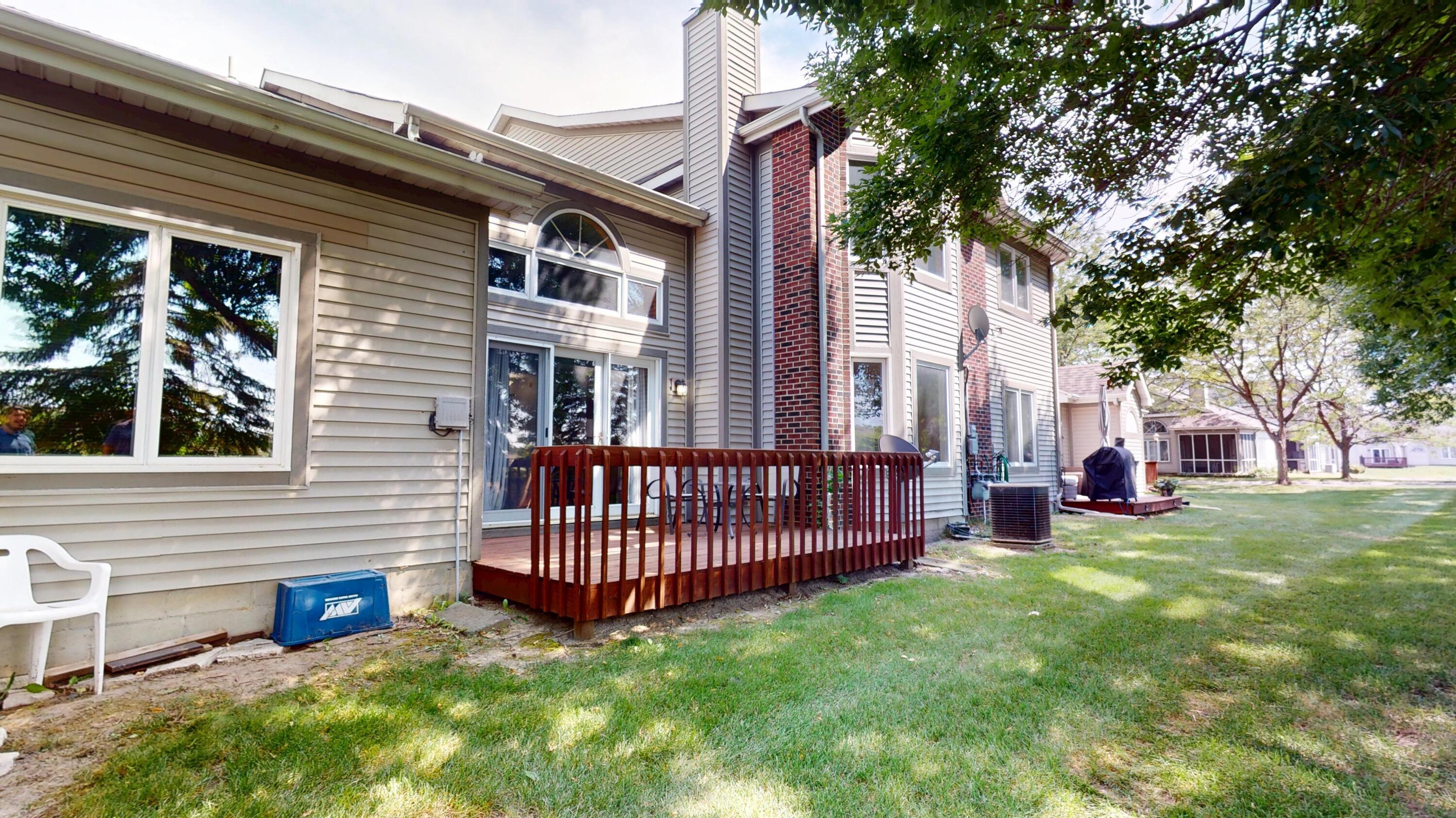 9344 Van Buren Street Crown Point, IN 46307 - Photo 35 of 37 a view of a house with a yard and deck