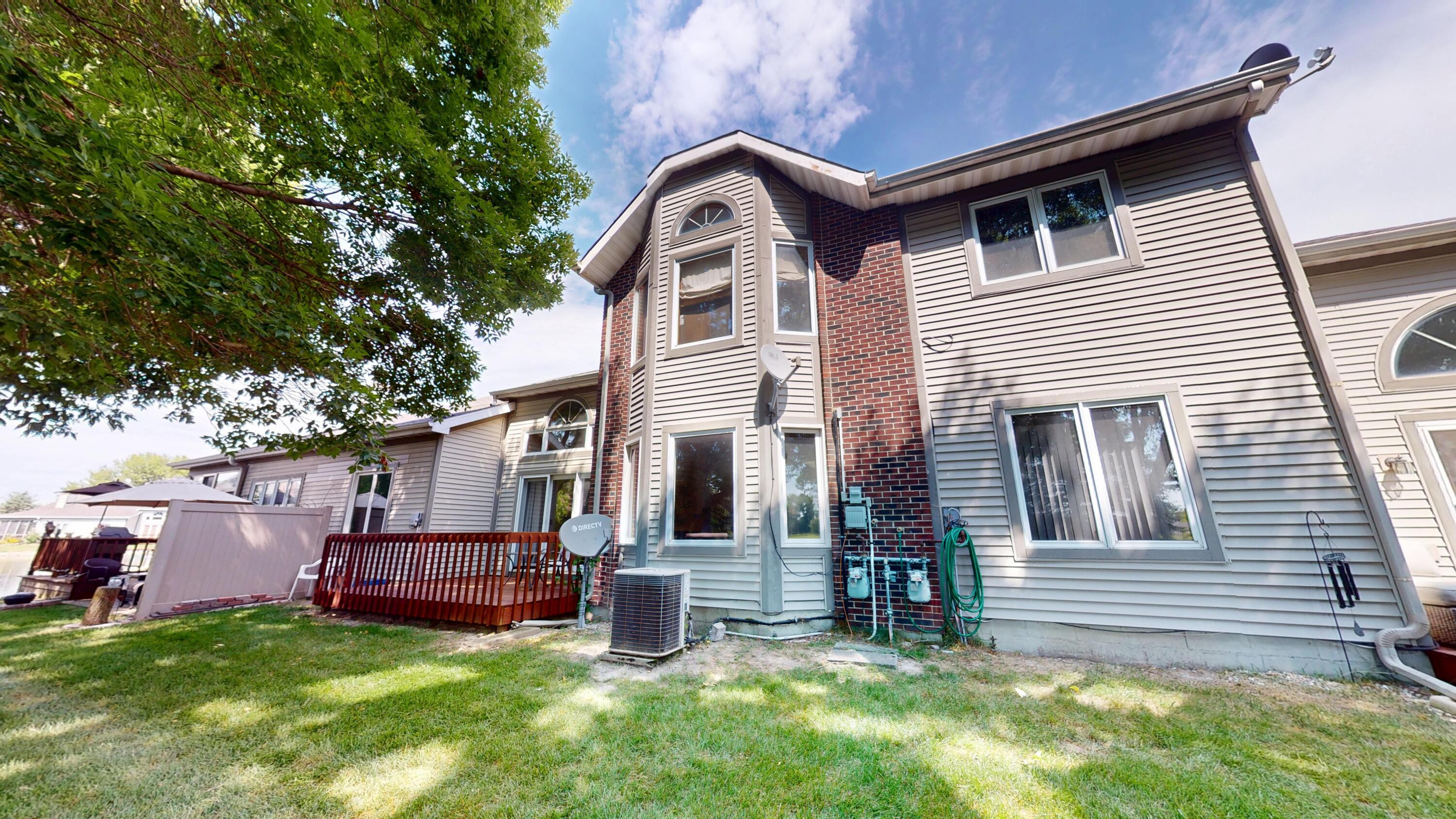 9344 Van Buren Street Crown Point, IN 46307 - Photo 36 of 37 a front view of a house with a garden