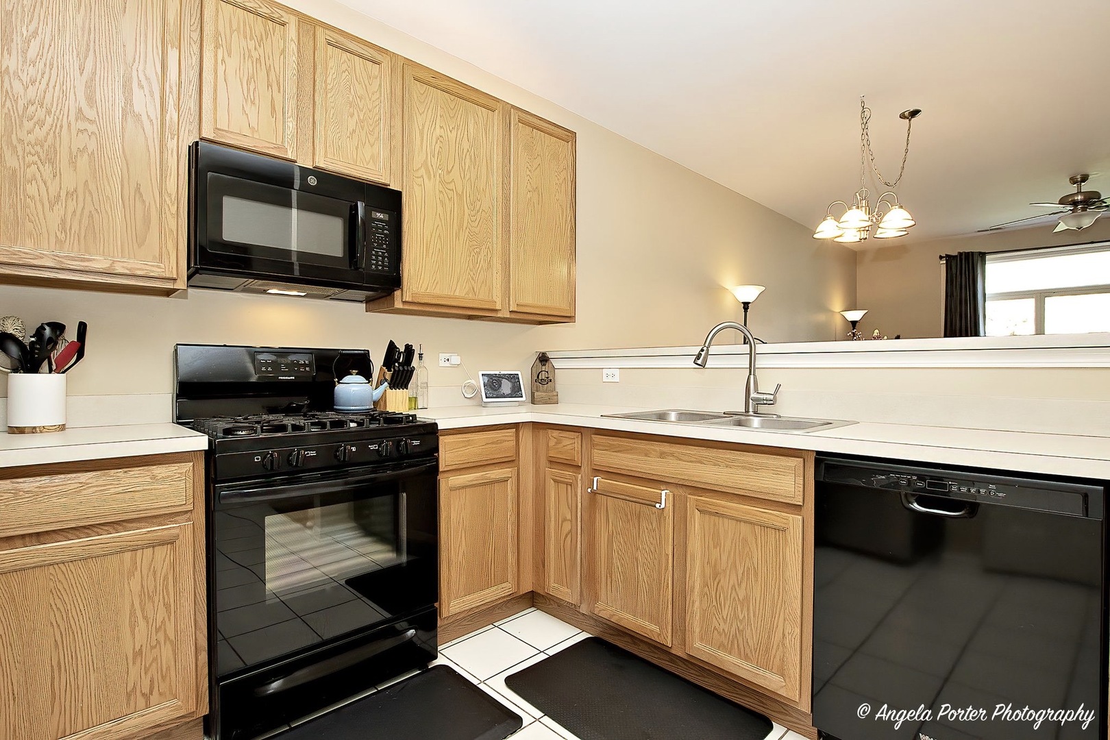 3012 Falling Waters Lane Lindenhurst, IL 60046 - Photo 3 of 21 a kitchen with a sink stove and microwave