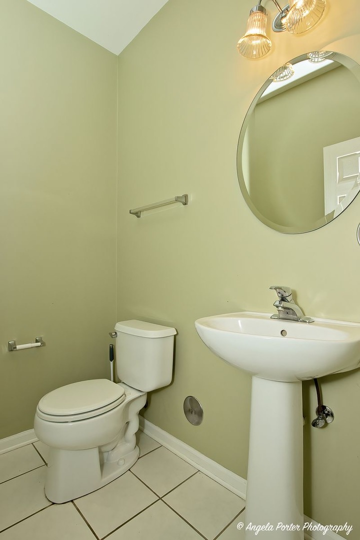 3012 Falling Waters Lane Lindenhurst, IL 60046 - Photo 10 of 21 a bathroom with a sink and a mirror