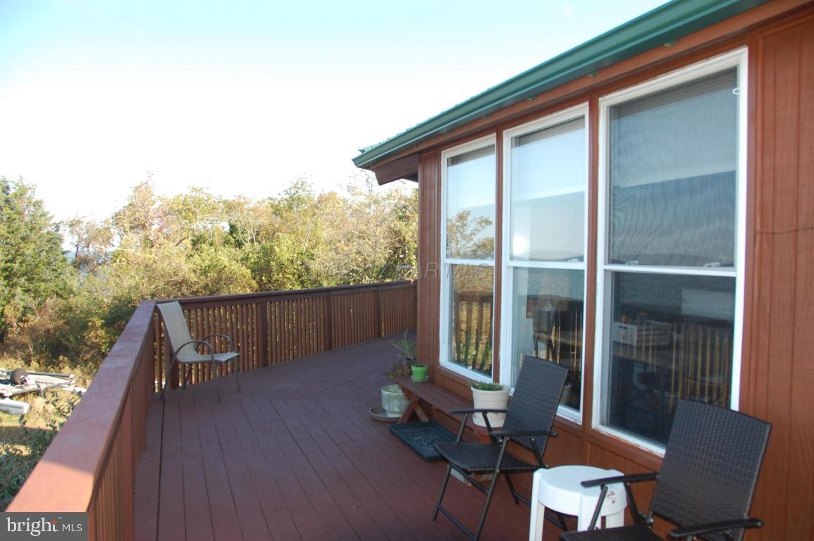 10770 Harrison Point Road Deal Island, MD 21821 - Photo 28 of 29 a view of balcony with furniture and city view