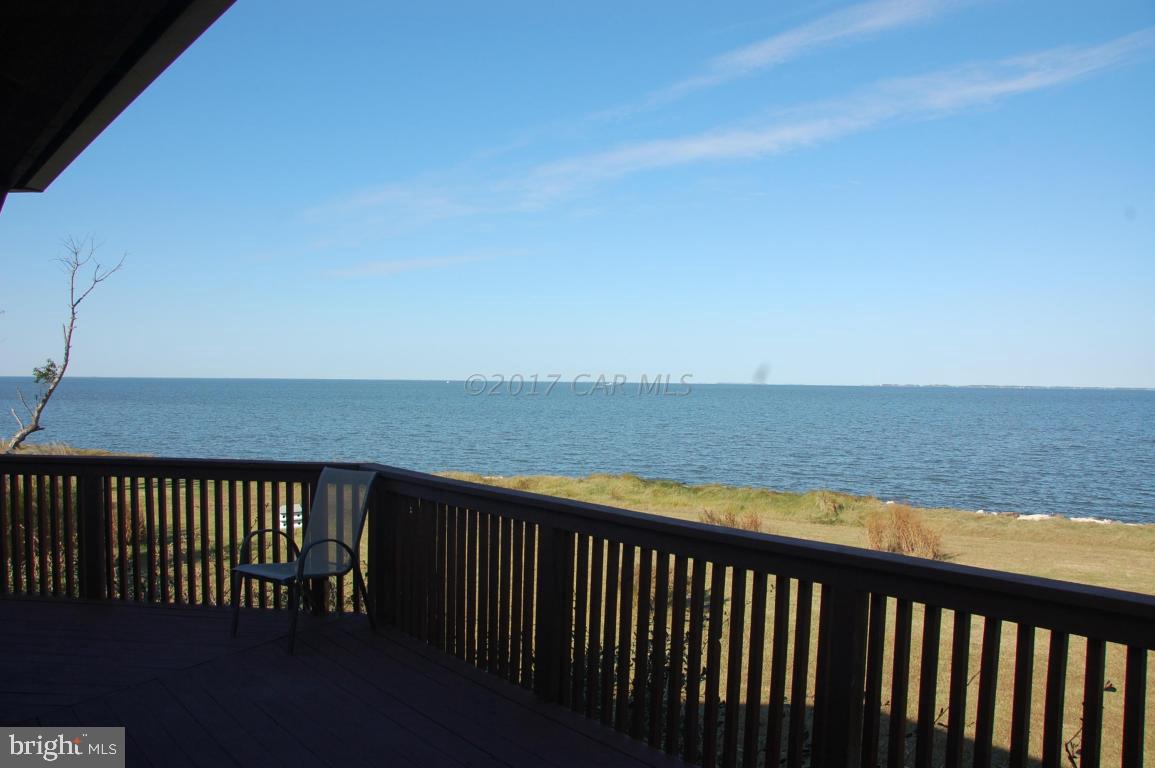 10770 Harrison Point Road Deal Island, MD 21821 - Photo 4 of 29 a view of roof deck with wooden floor and fence
