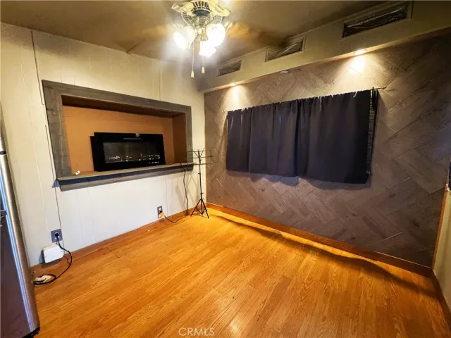 a view of an empty room with a fireplace