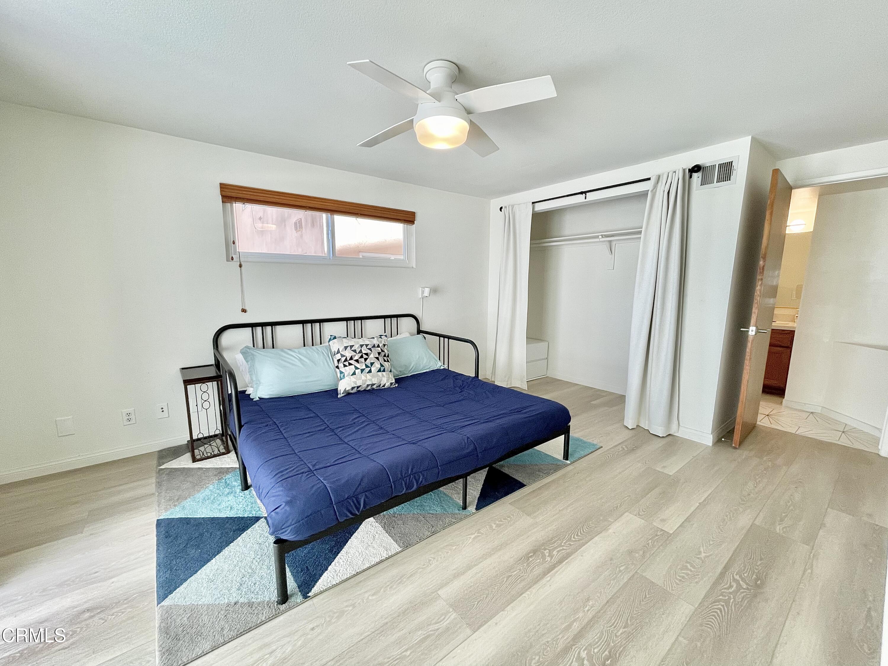 361 Rossmore Drive Oxnard, CA 93035 - Photo 23 of 26 a bed room with a bed and a window